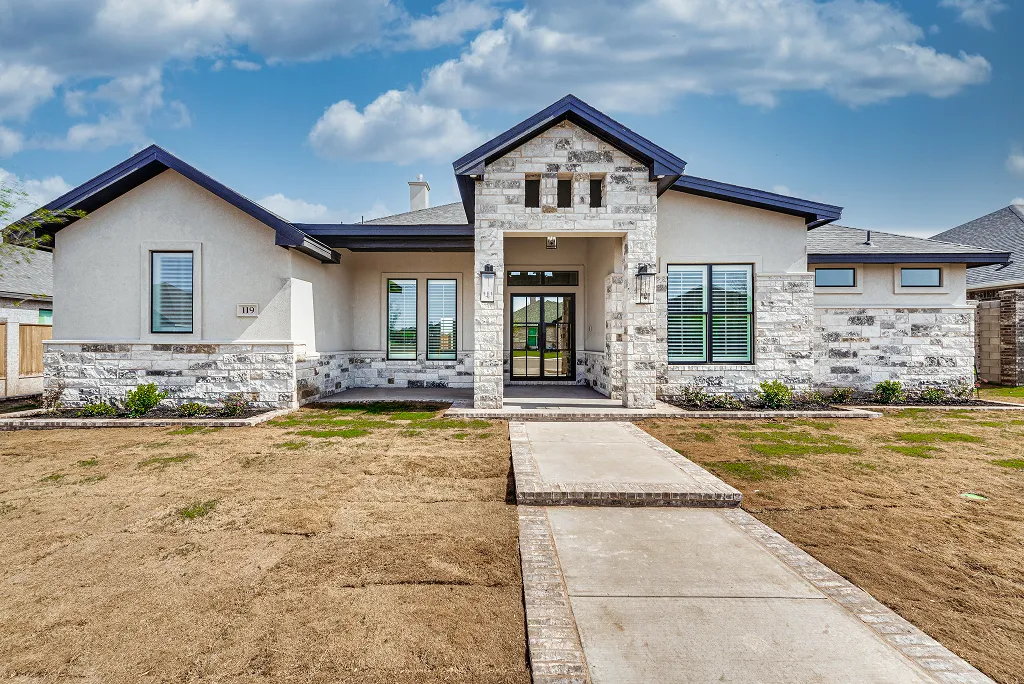 Front exterior of 119 Rolling Winds Circle, Odessa TX with 3-car garage on corner lot