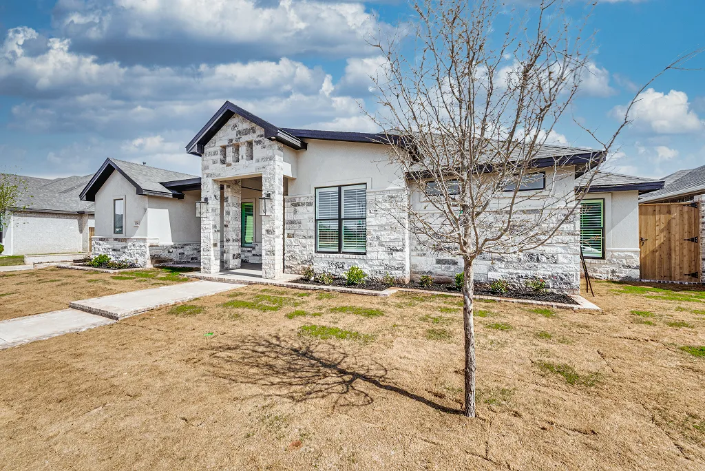 Right side elevation of 4-bedroom home for sale at 119 Rolling Winds Circle in Midland County